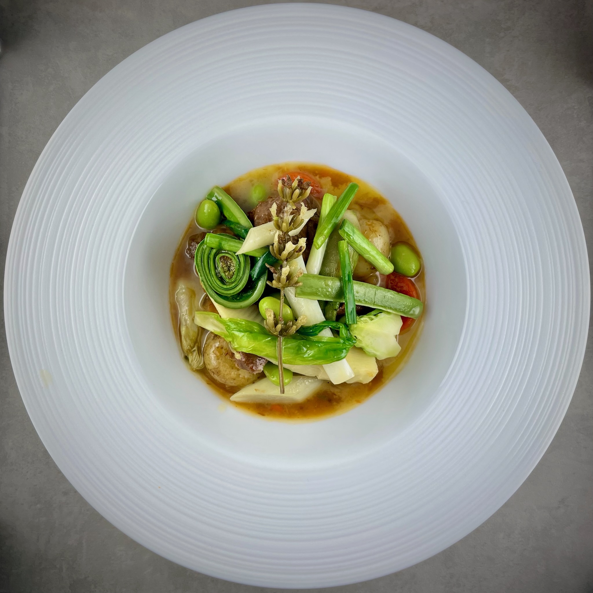 Spring vegetable broth with fiddlehead fern at Rangitoto Tokyo