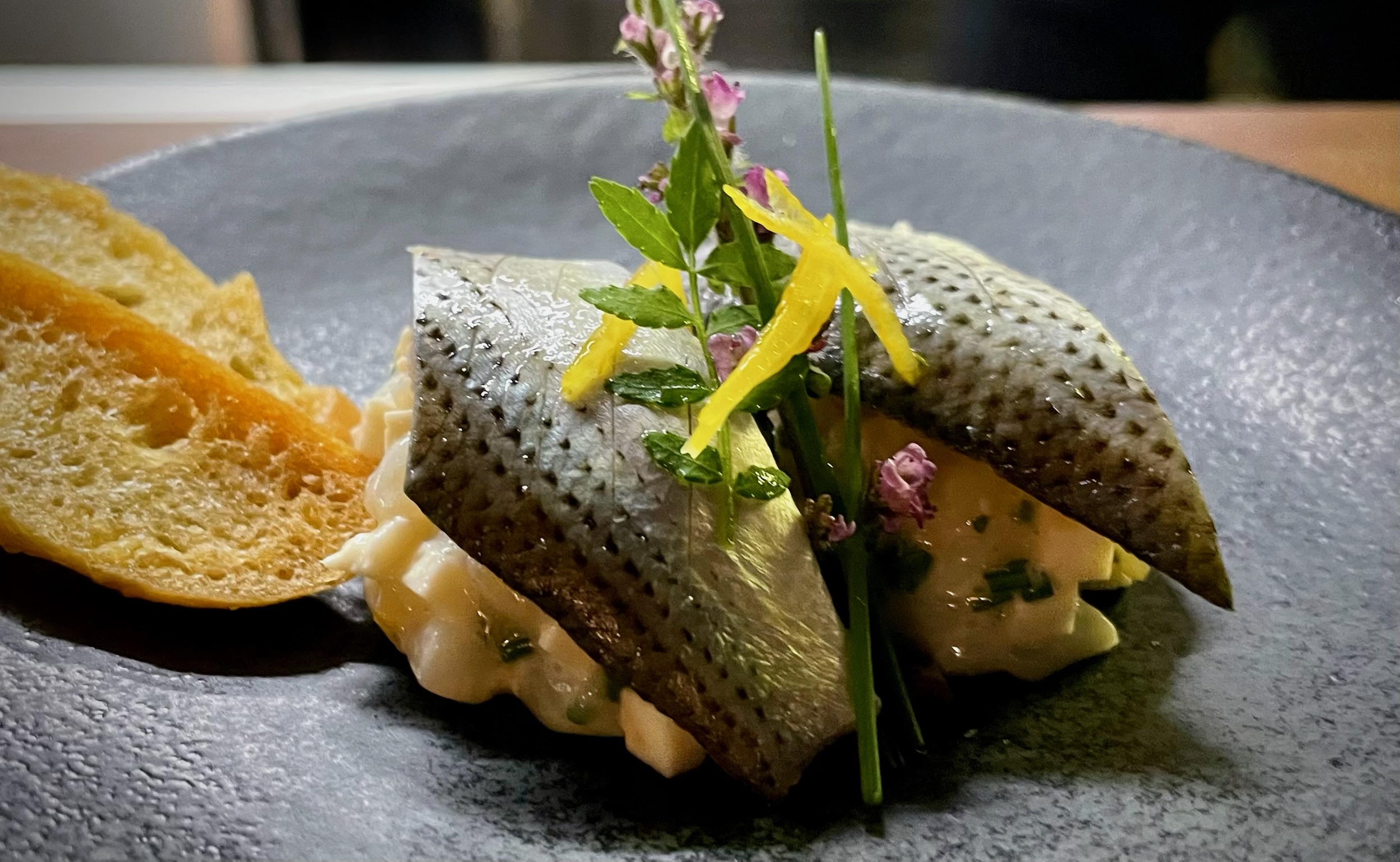 Pan-seared fish with herbs and crostini at Rangitoto Tokyo